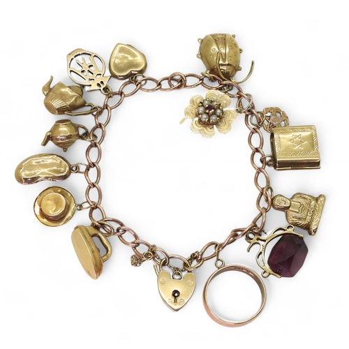 819 - A 9ct gold curb chain charm bracelet, including eleven 9ct gold charms and four yellow metal charms,... 