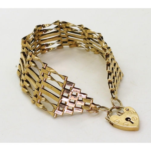 823 - A 9ct gold fancy gate bracelet, length approx. 18.5cm, weight 13.3gms