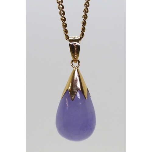 828 - A 14ct gold mounted purple jadeite pendant, weight 2.6gms, with a 9ct gold chain, weight 3.0gms