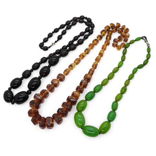 833A - A string of brown amber beads, weight 84.2gms, with an example of amber beads, weight 97.4gms and a ... 