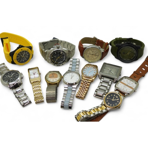 869 - A collection of gents fashion watches to include Ted Baker, Sekonda, Guess, Nautica, Delbana etc