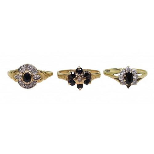 713 - Three 9ct gold rings, sapphire flower ring with diamond accent, size M, sapphire and diamond ring, s... 