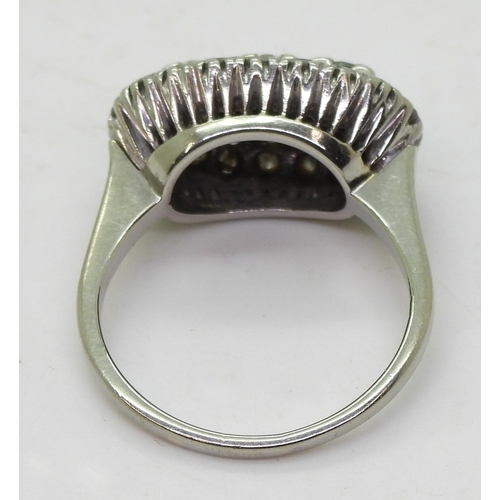 2706 - A DIAMOND DRESS RINGthe 18ct white gold ring with galleried mount is set with estimate approx 1ct of... 