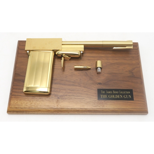 2646 - JAMES BOND: THE MAN WITH THE GOLDEN GUN (1974)A 24 karat gold-plated replica Golden Gun produced by ... 