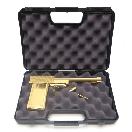 2646 - JAMES BOND: THE MAN WITH THE GOLDEN GUN (1974)A 24 karat gold-plated replica Golden Gun produced by ... 