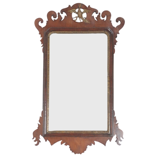 2014 - A 19TH CENTURY MAHOGANY FRETCUT WALL MIRROR with carved gilt eagle decoration, 77cm high x 46cm... 