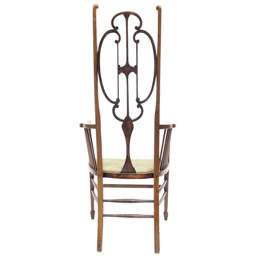 2018 - A 19TH CENTURY MAHOGANY LIBERTY STYLE HIGH BACK HALL CHAIR with stylized shaped backrest over u... 