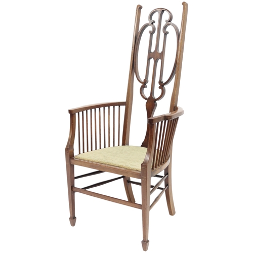 2018 - A 19TH CENTURY MAHOGANY LIBERTY STYLE HIGH BACK HALL CHAIR with stylized shaped backrest over u... 