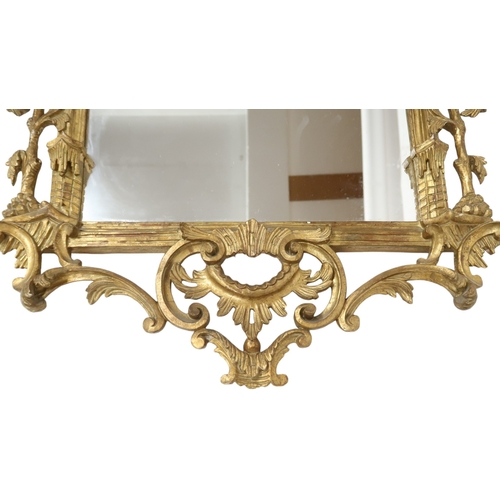 2023 - A GEORGIAN STYLE GILTWOOD CHINESE CHIPPENDALE WALL MIRROR with stylized carved pagoda surmount ... 