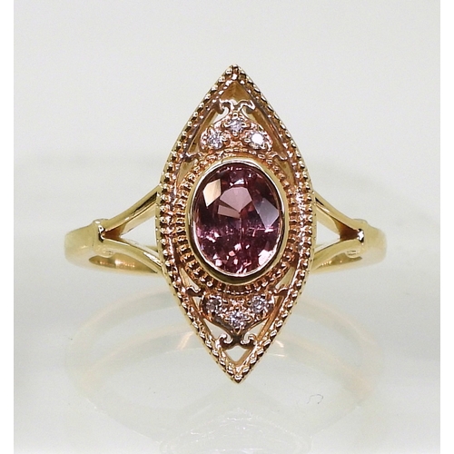 2719 - A SAPPHIRE AND DIAMOND RINGthe 14k marquis shaped mount is set with a padparadscha colour sapph... 