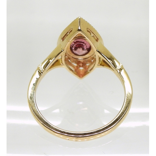 2719 - A SAPPHIRE AND DIAMOND RINGthe 14k marquis shaped mount is set with a padparadscha colour sapph... 