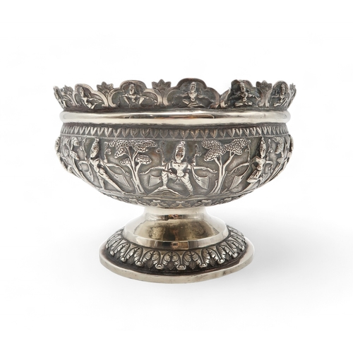 2531 - AN INDIAN SILVER FOOTED BOWLchased in high relief, depicting aspara amongst trees, the decoration co... 