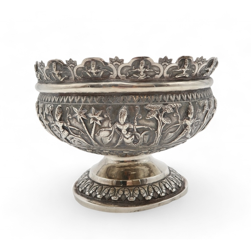 2531 - AN INDIAN SILVER FOOTED BOWLchased in high relief, depicting aspara amongst trees, the decoration co... 