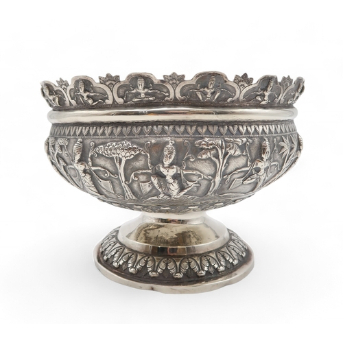 2531 - AN INDIAN SILVER FOOTED BOWLchased in high relief, depicting aspara amongst trees, the decoration co... 