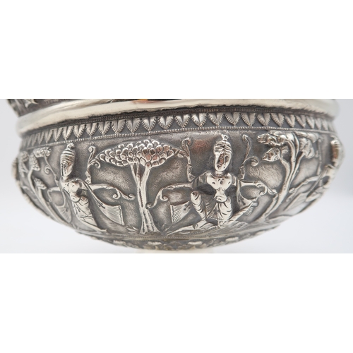 2531 - AN INDIAN SILVER FOOTED BOWLchased in high relief, depicting aspara amongst trees, the decoration co... 