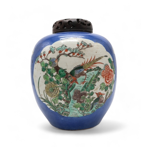 2411 - A CHINESE BLUE GROUND GINGER JAR Painted with landscape panels, exotic birds, flowers and foliage, w... 