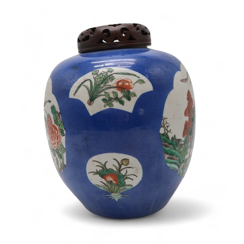 2411 - A CHINESE BLUE GROUND GINGER JAR Painted with landscape panels, exotic birds, flowers and foliage, w... 