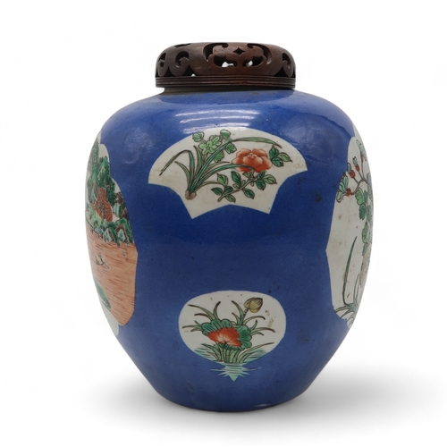 2411 - A CHINESE BLUE GROUND GINGER JAR Painted with landscape panels, exotic birds, flowers and foliage, w... 