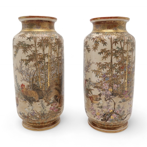 2412 - A PAIR OF SATSUMA CYLINDRICAL VASES Painted with game birds amongst bamboo and blossoming plants, se... 