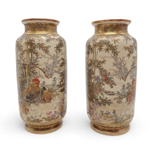 2412 - A PAIR OF SATSUMA CYLINDRICAL VASES Painted with game birds amongst bamboo and blossoming plants, se... 