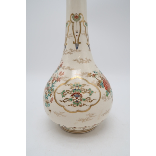 2414 - A SATSUMA ONION SHAPED VASEPainted with ogival panels of foliage, divided by scattered flowers and b... 