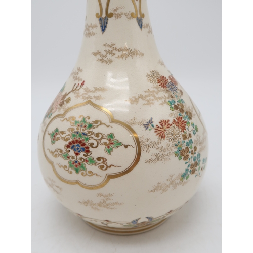 2414 - A SATSUMA ONION SHAPED VASEPainted with ogival panels of foliage, divided by scattered flowers and b... 