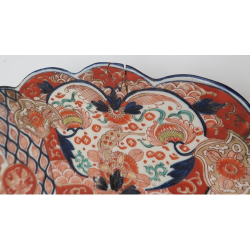 2420 - A LARGE IMARI CHARGER Painted with panels of flowers, Ho-o birds, diaper and mon decoration, 58cm di... 