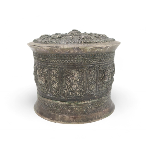 2422 - A BURMESE WHITE METAL BETEL BOX Cast with figures and animals, 8.5cm high and 10.5cm diameter, bambo... 