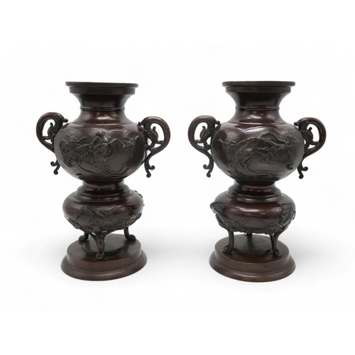 2424 - A PAIR OF JAPANESE BRONZE VASES Cast with panels of birds amongst branches and clouds, with serpent ... 