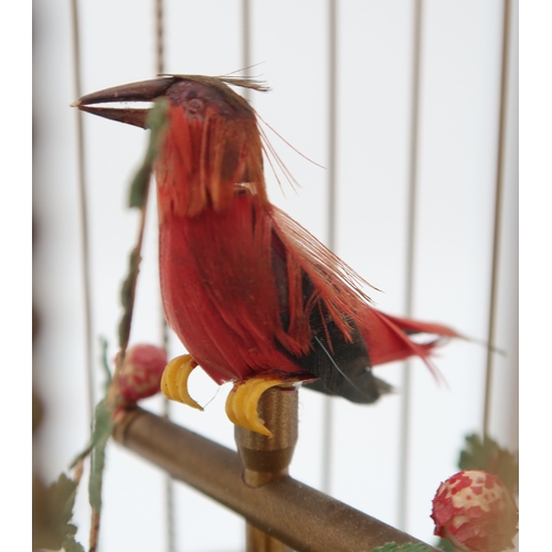 2231 - A MID 20TH CENTURY GERMAN MUSICAL BIRD CAGEwith two feathered automaton birds, 28cm high... 