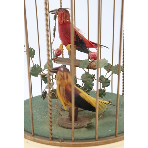 2231 - A MID 20TH CENTURY GERMAN MUSICAL BIRD CAGEwith two feathered automaton birds, 28cm high... 