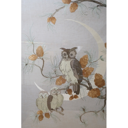 2251 - AN EARLY 20TH CENTURY SILK WORK PANELsewn with a design of an owl and owlets within a pine tree ador... 