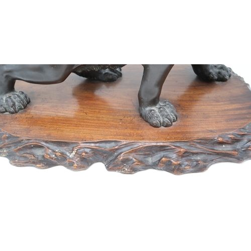 2427 - A JAPANESE BRONZE MODEL OF A ROARING LION Standing on all fours and mounted on a craved hardwood pla... 