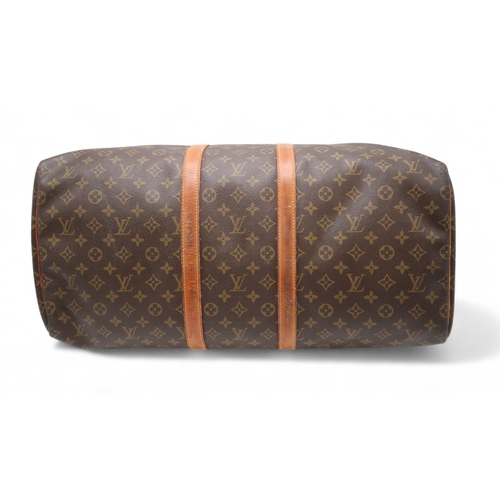 2647 - A LOUIS VUITTON KEEPALL MONOGRAM DUFFLE BAGin monogram coated canvas, with tan vachetta leather trim... 