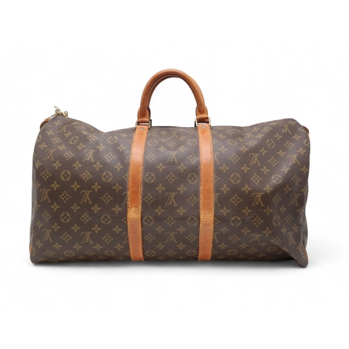 2647 - A LOUIS VUITTON KEEPALL MONOGRAM DUFFLE BAGin monogram coated canvas, with tan vachetta leather trim... 