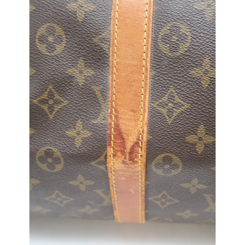 2647 - A LOUIS VUITTON KEEPALL MONOGRAM DUFFLE BAGin monogram coated canvas, with tan vachetta leather trim... 