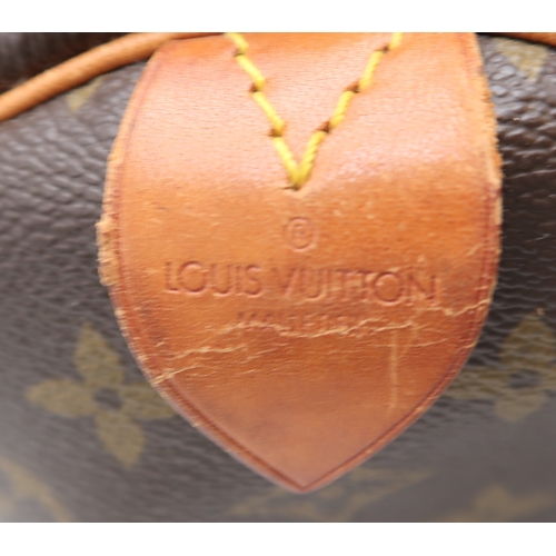 2647 - A LOUIS VUITTON KEEPALL MONOGRAM DUFFLE BAGin monogram coated canvas, with tan vachetta leather trim... 