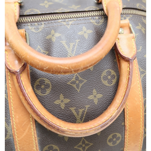 2647 - A LOUIS VUITTON KEEPALL MONOGRAM DUFFLE BAGin monogram coated canvas, with tan vachetta leather trim... 