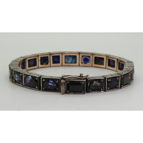 2721 - A SAPPHIRE BRACELETset with mixed cut sapphires tapering in size roughly from 7.8mm x 10mm to 5.5mm ... 