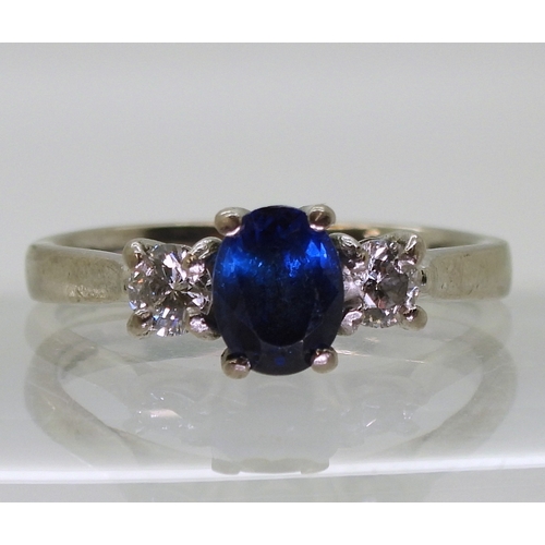 2723 - A SAPPHIRE & DIAMOND THREE STONEset in 18ct white gold the central sapphire is approx 7mm x 5.4m... 