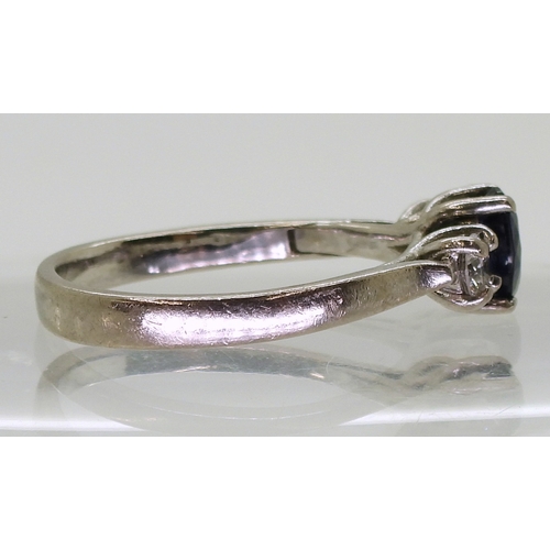 2723 - A SAPPHIRE & DIAMOND THREE STONEset in 18ct white gold the central sapphire is approx 7mm x 5.4m... 