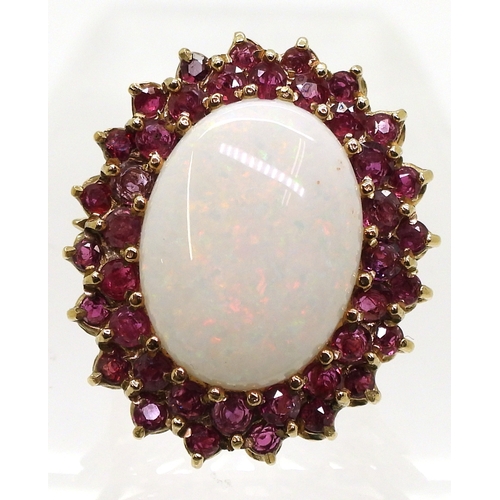 2725 - RUBY & OPAL RINGthis large statement ring, is set with a white opal cabochon of approx 20mm x 15... 