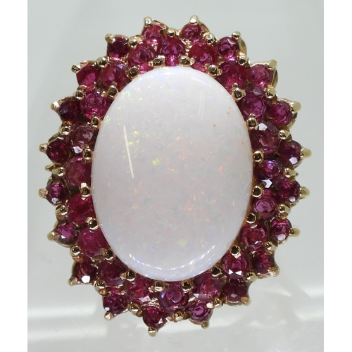 2725 - RUBY & OPAL RINGthis large statement ring, is set with a white opal cabochon of approx 20mm x 15... 