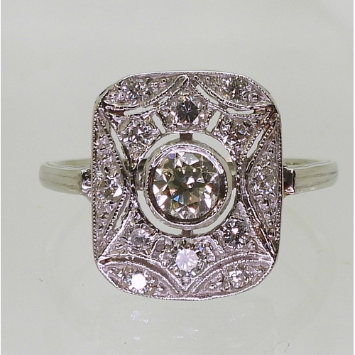 2730 - A DIAMOND PANEL RINGmounted throughout in platinum, with pierced detail. Set with estimated approx 0... 