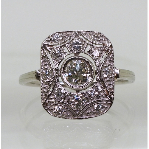 2730 - A DIAMOND PANEL RINGmounted throughout in platinum, with pierced detail. Set with estimated approx 0... 