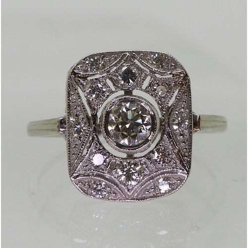 2730 - A DIAMOND PANEL RINGmounted throughout in platinum, with pierced detail. Set with estimated approx 0... 