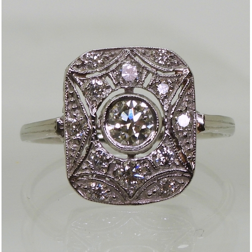 2730 - A DIAMOND PANEL RINGmounted throughout in platinum, with pierced detail. Set with estimated approx 0... 