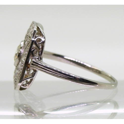 2730 - A DIAMOND PANEL RINGmounted throughout in platinum, with pierced detail. Set with estimated approx 0... 