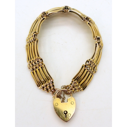 2737 - A DECORATIVE BRACELETmade in 9ct gold with cross and baton shaped links and a heart shaped clasp, ha... 