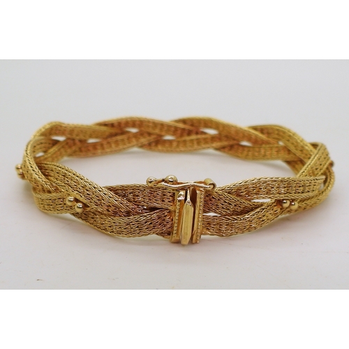 2738 - A WOVEN CHAIN BRACELETmade in bright yellow metal stamped 750 ASIAGOLD. Length 19.5cm, weight 20.2gm... 